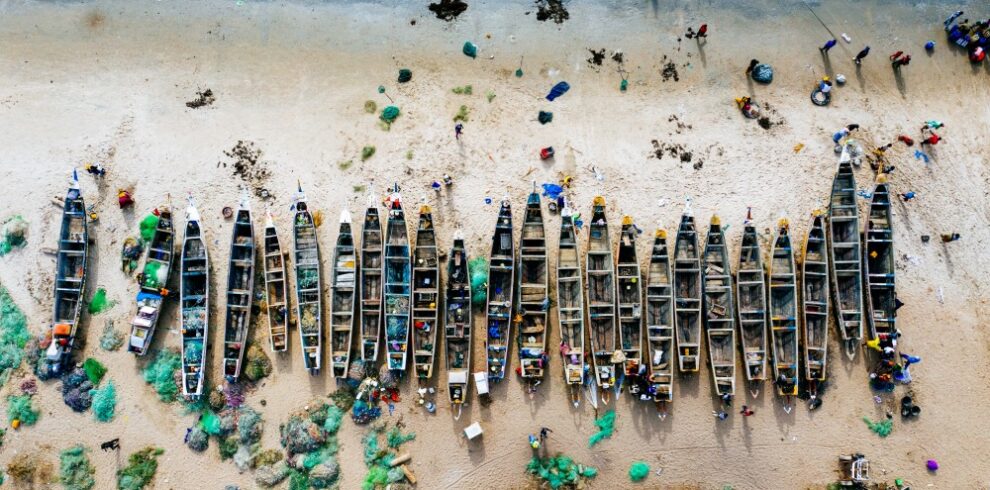 BIG_overhead-aerial-shot-different-colored-boats-sandy-beach-with-sea-nearby_1696711121110