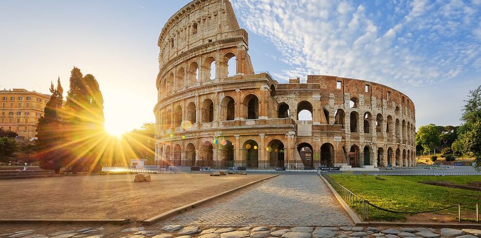 Colosseum in Rome and morning sun, Italy